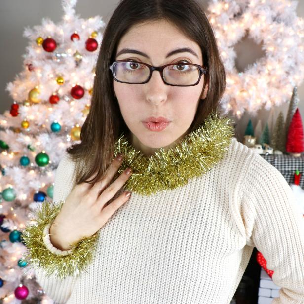 Woman Wearing Sweater With Tinsel Garland Collar 