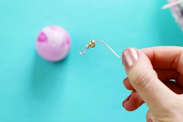 To create the hanger, bend an earring hook to remove the spring and replace it with a bead.