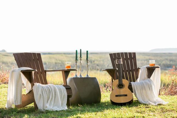 Pair of Adirondack Chairs With Cozy White Throws on Top