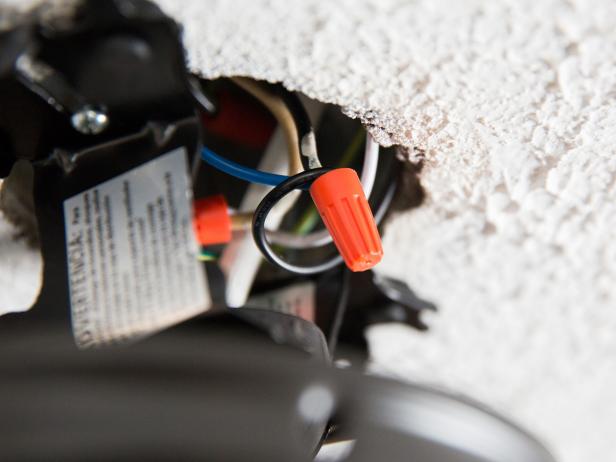 Place the two black (hot) wires side by side and twist them together using a wire nut. Make sure your connection is tight and the wires aren’t going to come loose. Follow the same process with your white (neutral) wires, connecting them with a wire nut.