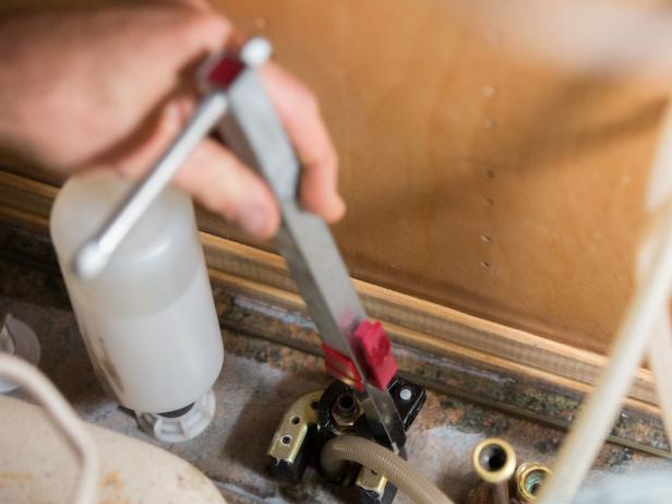 Your faucet and handles are held in place using metal or plastic nuts. It should be possible to loosen each of the nuts using your hand, or if they’re hard to reach, you can use your basin wrench.