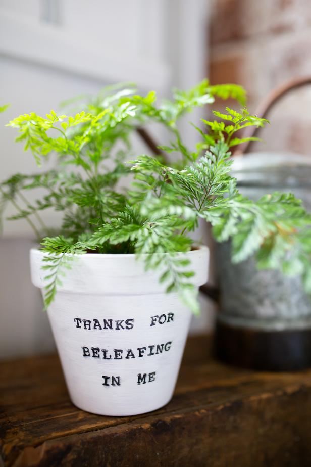 Fill a small terra cotta pot with mom's favorite plant, and add a pun to show her how much you love her this Mother's Day.