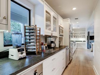Galley-Style Kitchen With White Cabinets