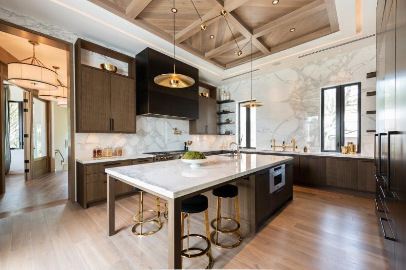Kitchen with Marble Walls and Countertops and Large Island