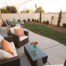 Contemporary Neutral Backyard with Brown Wicker Chairs and Table 