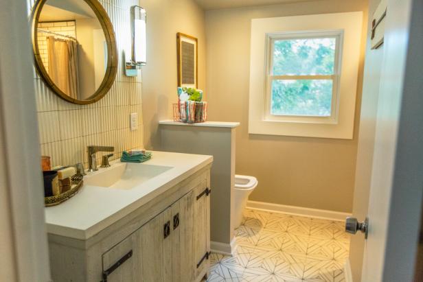 The After the new master en-suite bathroom that was built from the space found in the dormer adjacent to the master bedroom for the Home Suite Home pilot. New shower, graphic cermaic floor & wall tiles, and new vanity