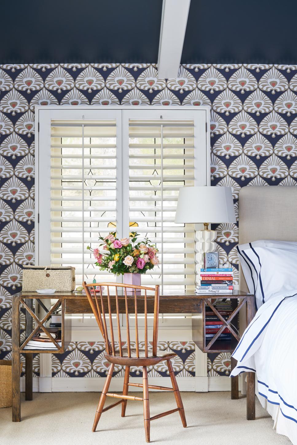 Bohemian Bedroom Office Close Up View Of Wooden Desk Near Bed With Patterned Wallpaper