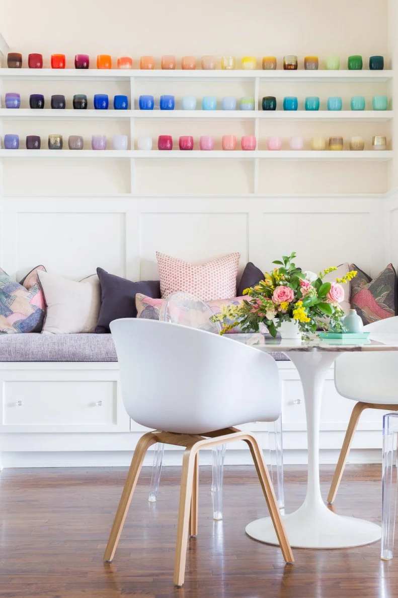 Kitchen Nook With Round Marble Table, Two Chairs, And Lots Of Candles