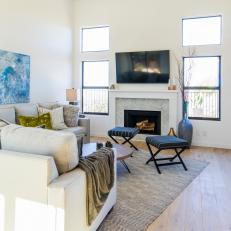 Contemporary White Living Room with Black Upholstered Stools 