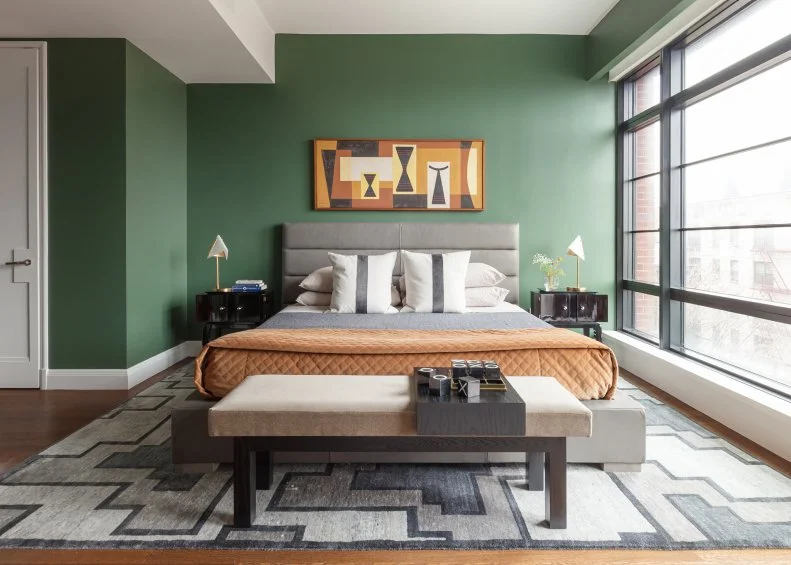 Modern Style Bed In Center Of Room With Wall Of Windows To The Right