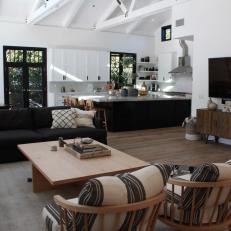Rustic Neutral Living Room with a Brown Coffee Table and Chairs 