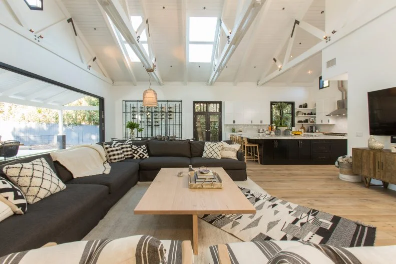 Black and White Living Room with Black and White Pillows on a Black Sectional 