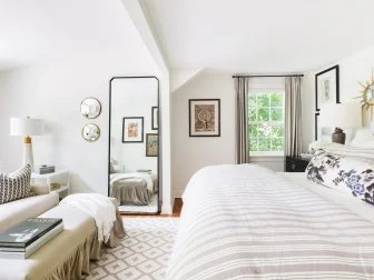 Swathed in neutral colors, this master bedroom is serene and tranquil. Beige and white brushed linens are light and airy and give the room a very casual feel. 

