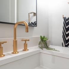 Gold-Toned Faucet in White Contemporary Powder Room