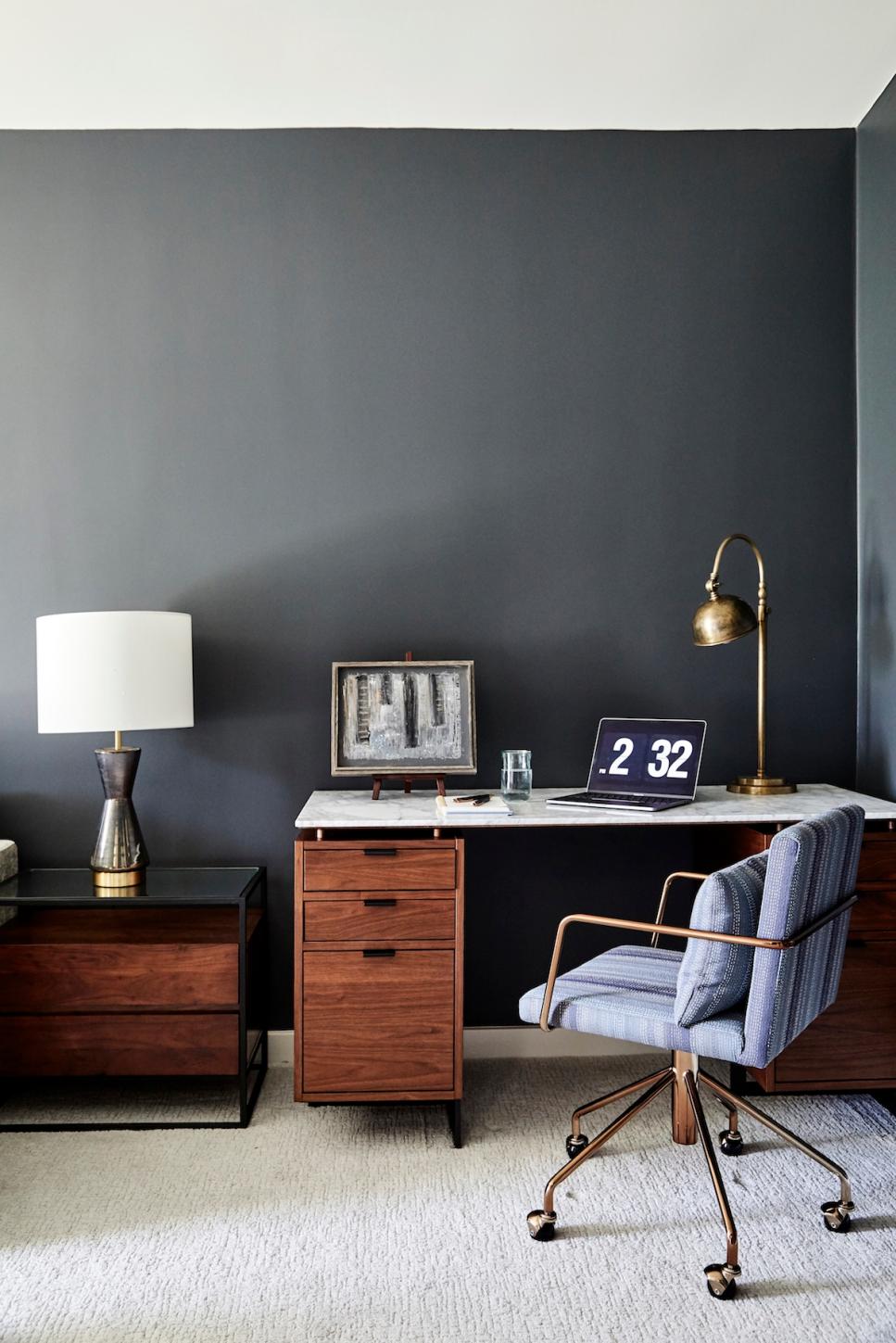 Contemporary Home Office With Brass Accents Dark Toned Home Office With Wooden Desk And Brass Lamp