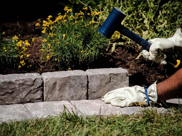 Use a level and rubber mallet as you go to ensure that the edge is even.