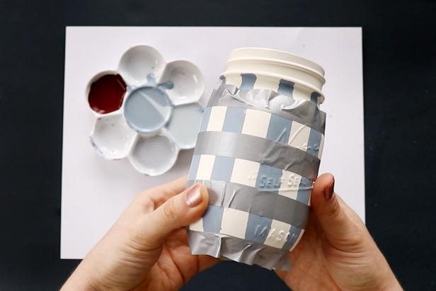 Mask off horizontal stripes using washi tape. Paint between the stripes using the same color paint. Remove the tape and let dry completely.