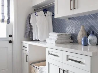 Laundry Room With Quartz Counter And Patchwork Tile Floors