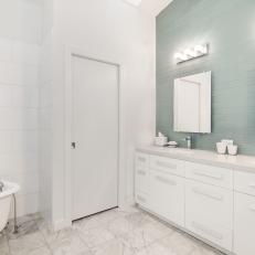 White Master Bathroom With Blue Accent Wall