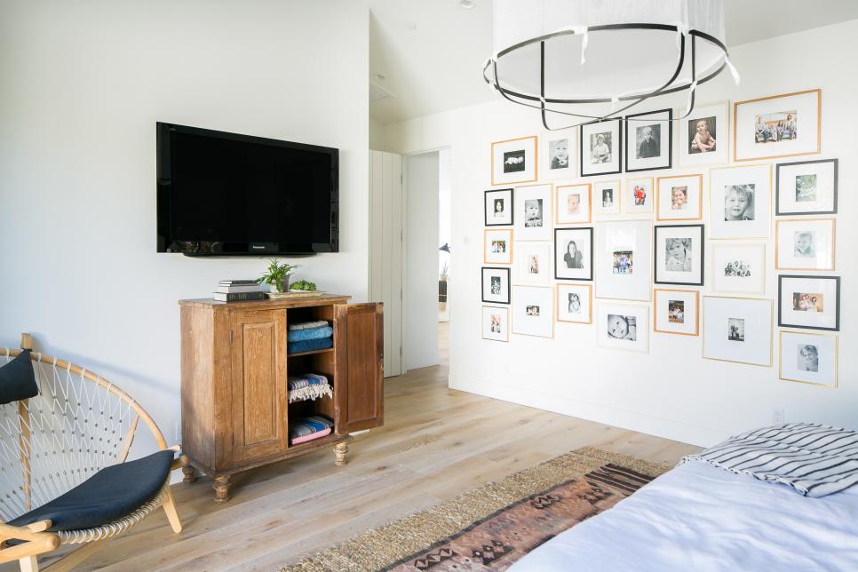 Transitional Bedroom With Framed Art Gallery Wall Art Gallery Wall In Transitional Bedroom With Linen Light Fixture