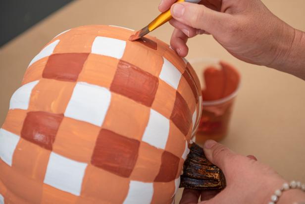Next, paint a square with dark orange anywhere the vertical and horizontal lines meet.