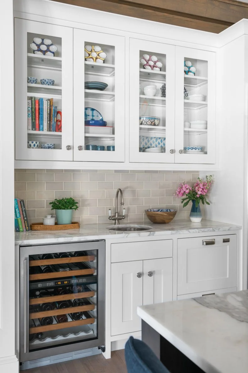 Glass front upper cabinets offer the chance to put cherished objects or decorative items on display. By simply changing out those items every few years, you can easily add a brand new look to the kitchen without any commitment involved.