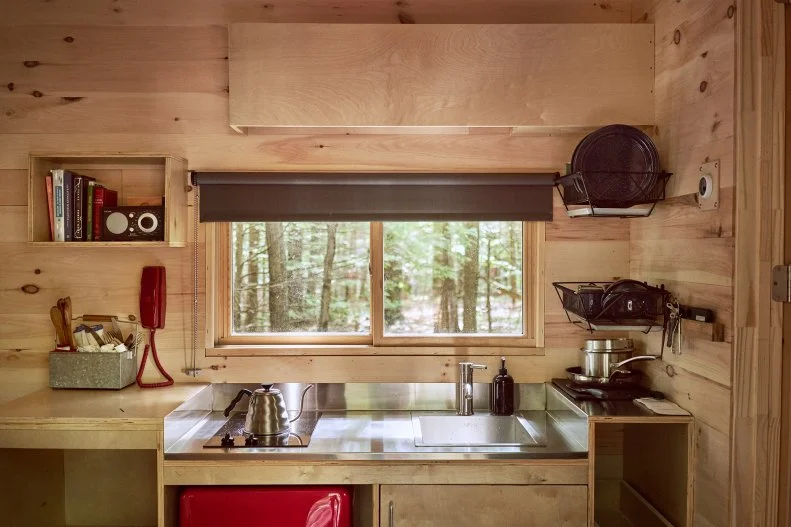 Not only does each Getaway camper come equipped with a mini-kitchen including sink, fridge, stovetop and cooking utensils, pots and pans, a decent selection of items like pasta and oatmeal will keep you and your crew from getting hangry if you forgot your vittles.