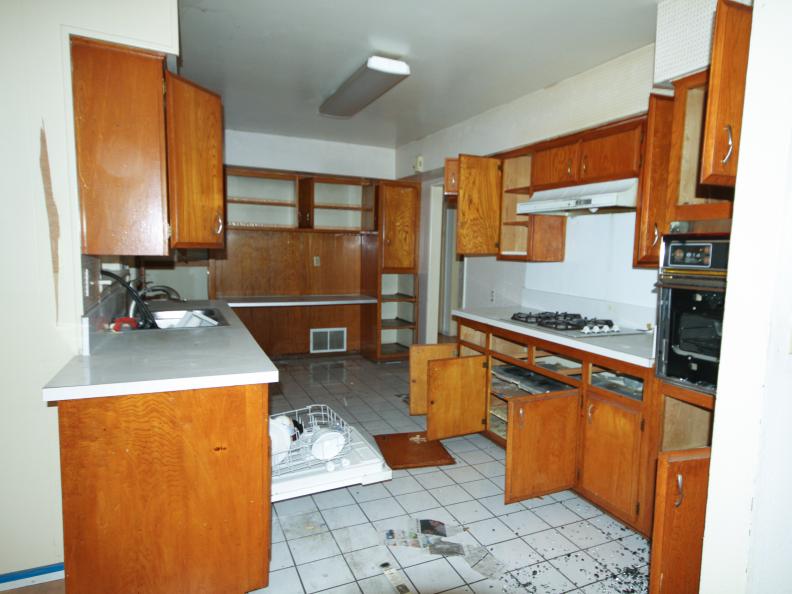 The dated kitchen of this Orange, CA home had been ransacked in a break-in before the renovation. As seen on HGTV's Flip or Flop.