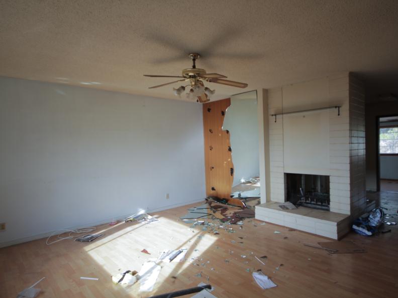 This dated living room in Orange, CA needs an upgrade, but the double sided fireplace is a great feature. As seen on HGTV's Flip or Flop.