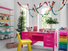 This gift wrapping studio space puts a brand new spin on Christmastime colors. It's decorated from floor to ceiling with highly saturated tones, putting a pop art spin on seasonal decor.