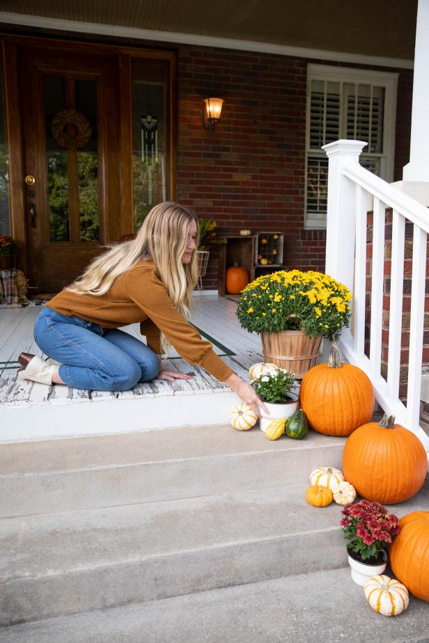 Putting Fall Decor on Front Porch Steps