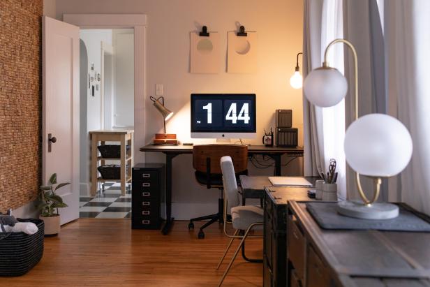 A minimalist, modern home office with retro globe lights shows how you can blend form and function.