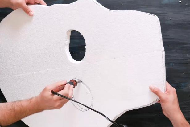 Be sure to work in a ventilated area and always wear a mask when cutting hot styrofoam. Refer to the instructions on the wood burning tool for use, then carefully use the hot knife point to cut the outline of the skull. Next, cut out the eyes, nose and jaw.