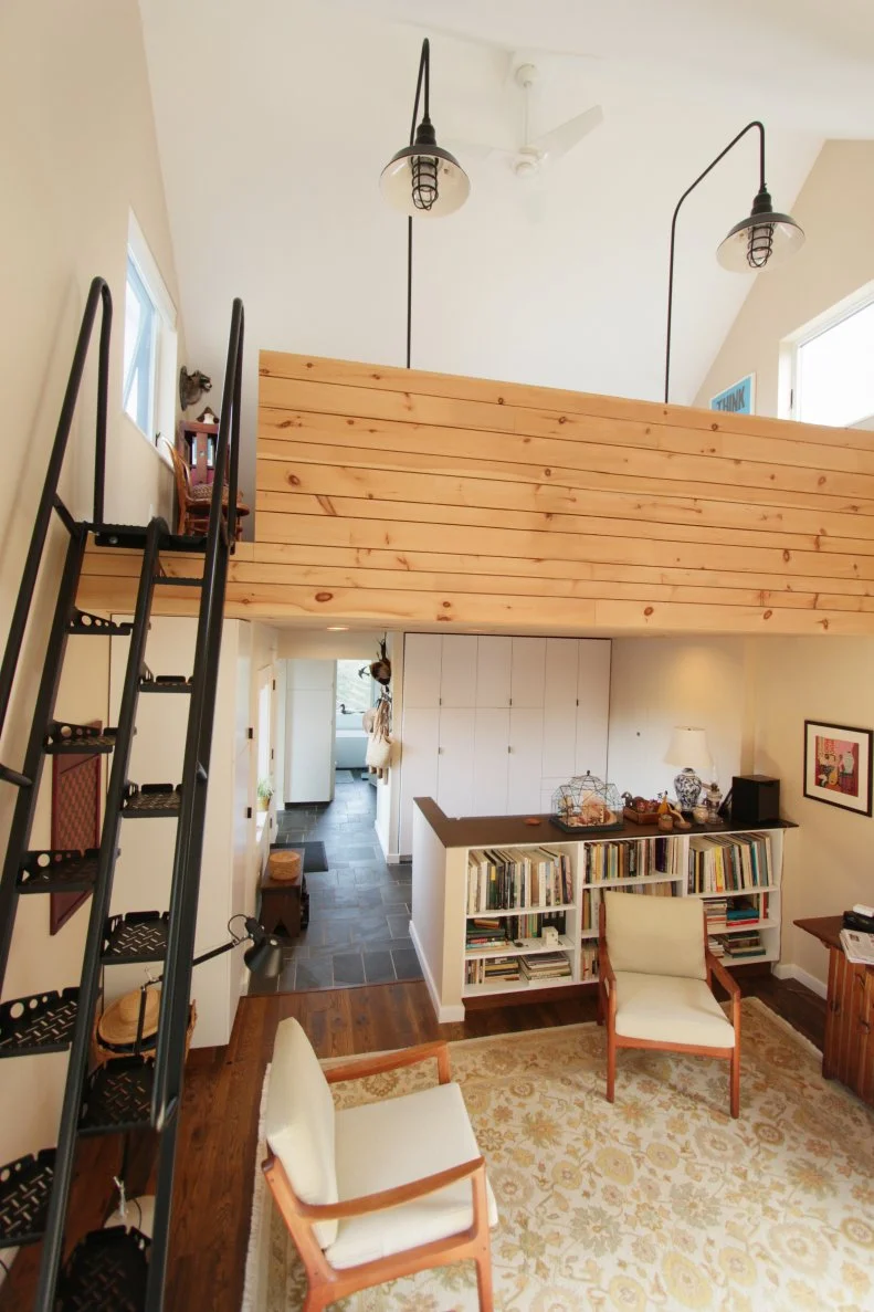 The homeowner uses the ground floor studio space in the barn portion of this home to work on her artwork.