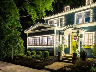 Roof Lined With Christmas Lights on Classic Home