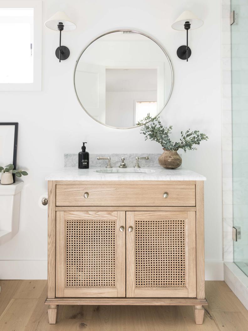 Yes, you can even use cane in the bathroom! The Pure Salt Interiors team did in this Costa Mesa, California project. An oak vanity pops against sparkling white walls, while cane detailing on the cabinet’s face gives added flair. “We love getting playful with materials to bring more interest to a room, especially in small spaces like this bathroom,” says Aly Morford and Leigh Lincoln, co-founders of Pure Salt.