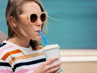 woman drinking from reusable straw