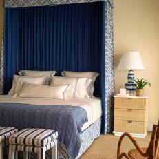 Refined Bedroom With Blue and White Canopy