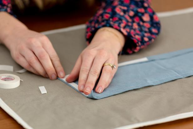 Upcycle an old shirt into a handy drawstring pouch perfect for traveling or quick errands.