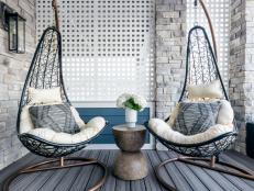 Pair of Swing Chairs and Round Side Table on Covered Patio