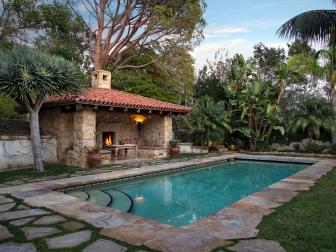 Private Swimming Pool With Poolside Cabana Fireplace and Stone Pavers