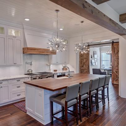 Open-Plan Farmhouse Kitchen With Silver Pendant Lights