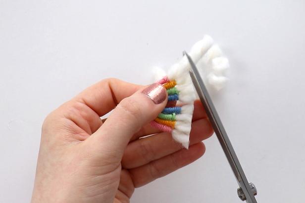 Trim the excess yarn and fluff it up to make the “clouds” at the end of the rainbow.