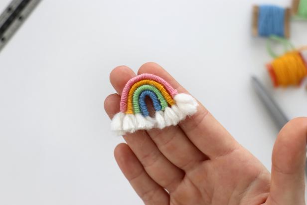 Trim the excess yarn and fluff it up to make the “clouds” at the end of the rainbow.