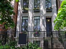 Wrought Iron Gate at to Lincoln Park Home With Limestone Facade