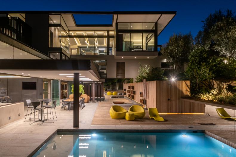 Modern Mansion Features a Backyard Swimming Pool and Covered Patio