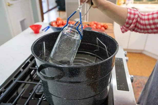 removing sterilized canning jar