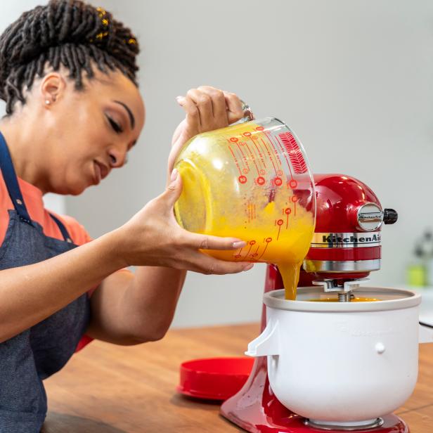woman pouring mango sorbet in ice cream maker