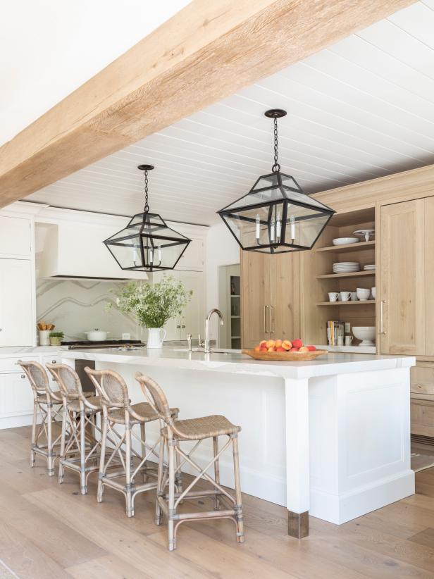 A Large Island and Natural Wood Cabinets Accent an Open Plan Kitchen