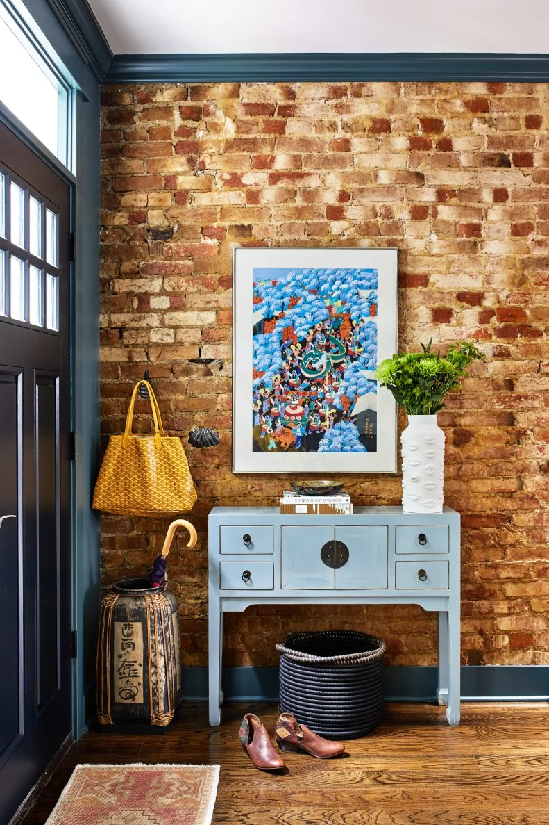 Bohemian Foyer With Rich Hardwoods, Exposed Brick, Pop Art